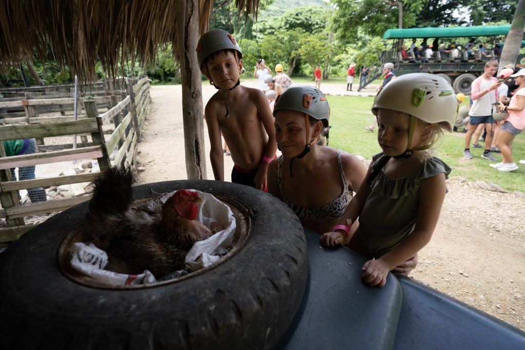 Family discovering the secrets of Dominican culture on the La Hacienda Park safari